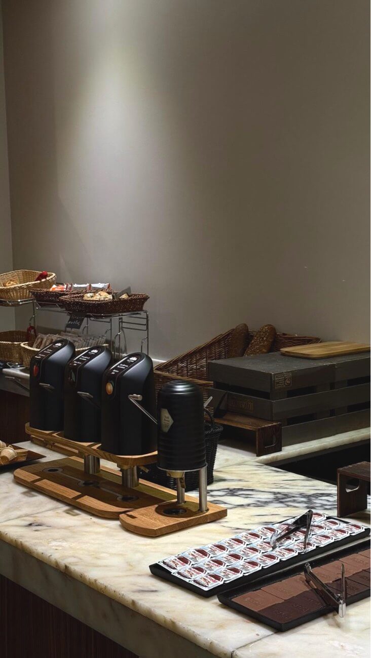 Coffee, bread and spread station at the breakfast buffet.
