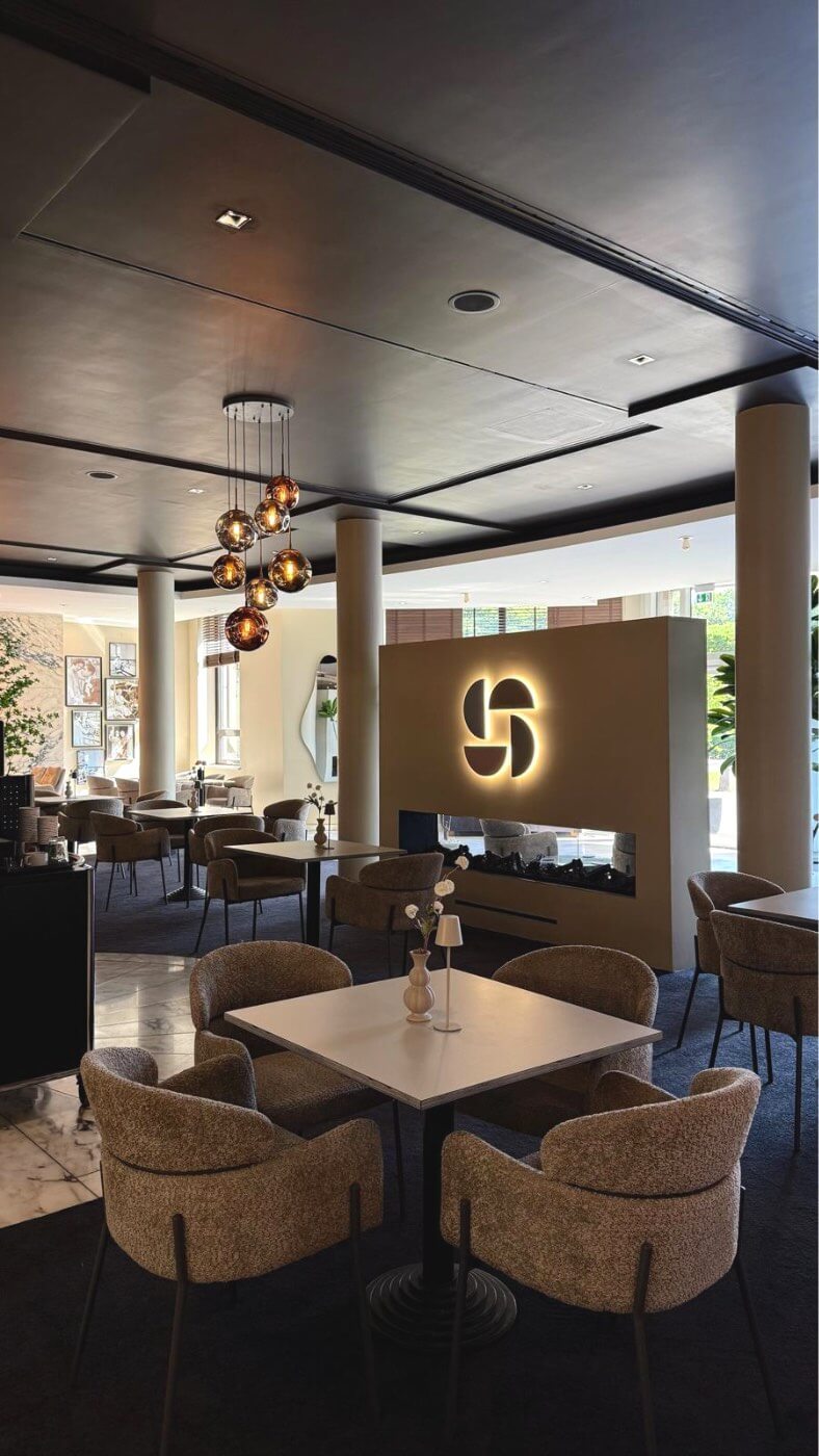 Restaurant dining room with warm lighting and guestified branding.